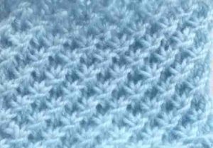 Le très beau point d'étoile au tricot