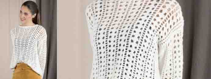 Un pull blanc aux dessins ajourés