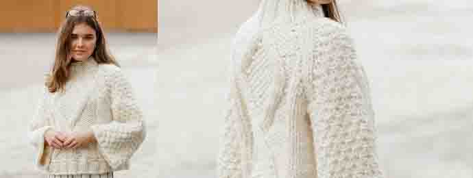 Tricot un pull court à grosse maille